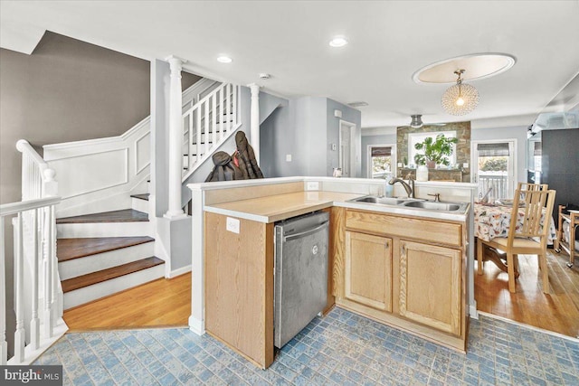 kitchen with sink, light brown cabinets, a kitchen island with sink, and dishwasher