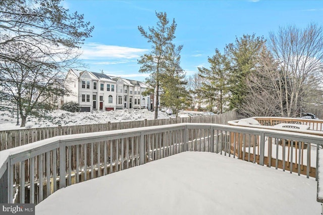 view of snow covered deck