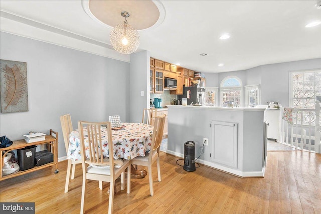 dining area with light hardwood / wood-style floors