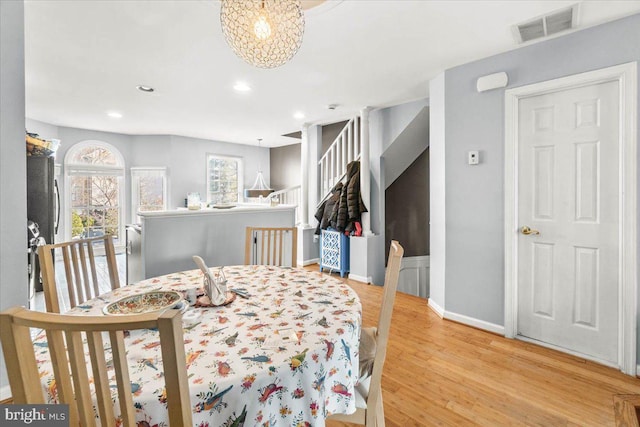 dining area with light hardwood / wood-style flooring