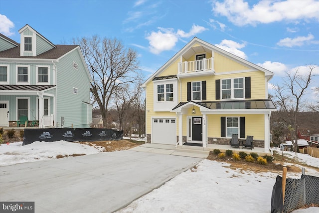 front of property featuring a garage and covered porch