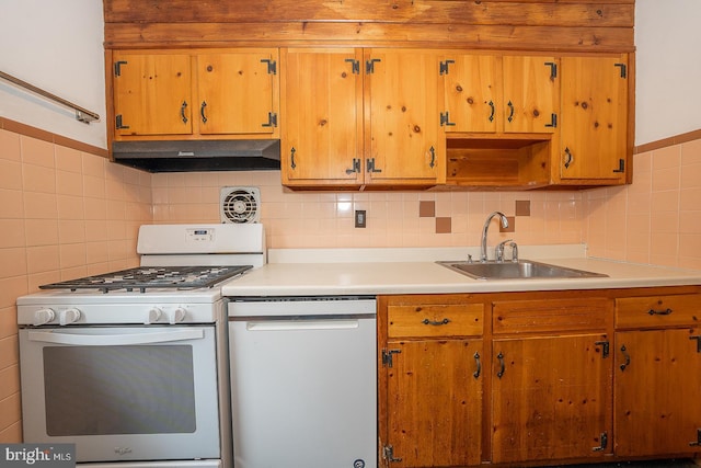 kitchen with sink, dishwasher, white gas range, and backsplash