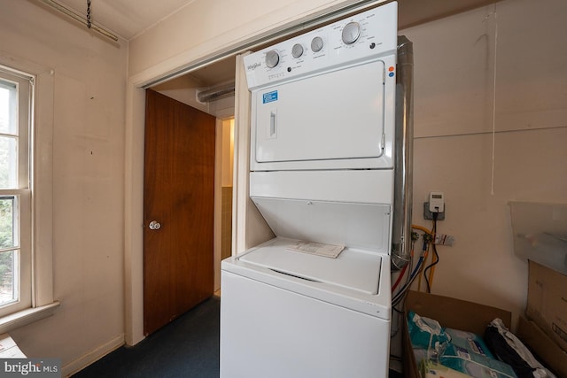 laundry area featuring stacked washer and clothes dryer