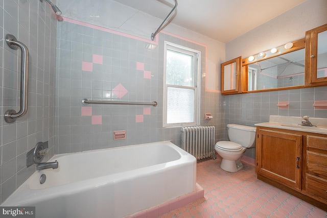 full bathroom featuring toilet, tile patterned flooring, tile walls, radiator heating unit, and vanity