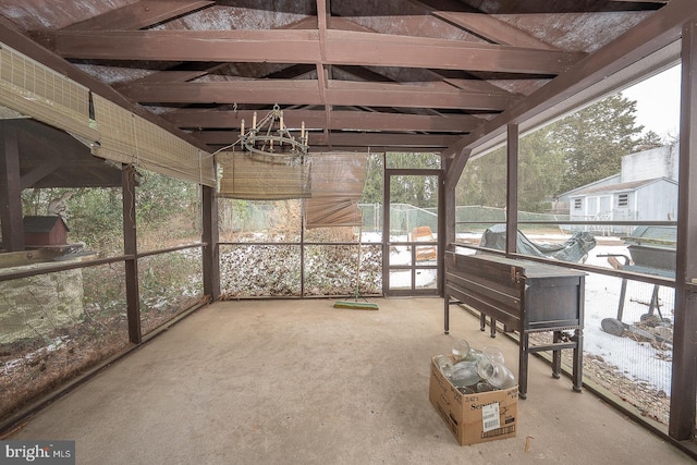 sunroom with an inviting chandelier