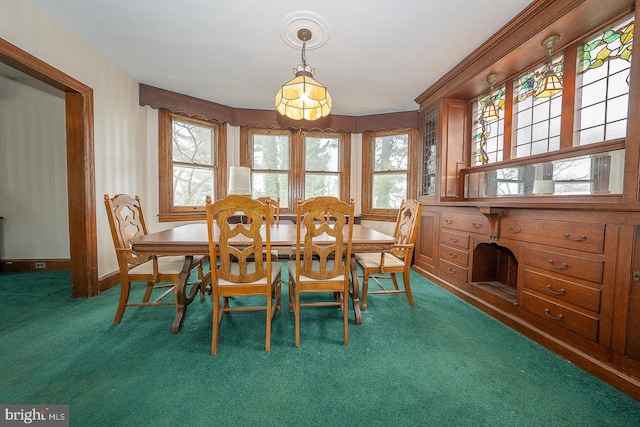 dining space with dark carpet