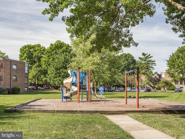 view of playground with a lawn