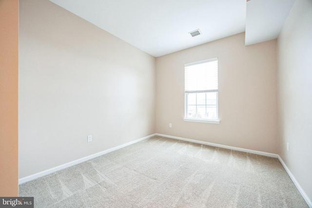 unfurnished room featuring carpet