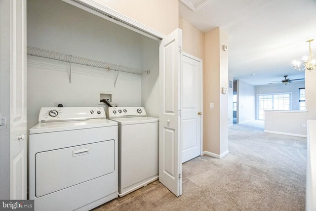 washroom with light carpet, ceiling fan with notable chandelier, and independent washer and dryer