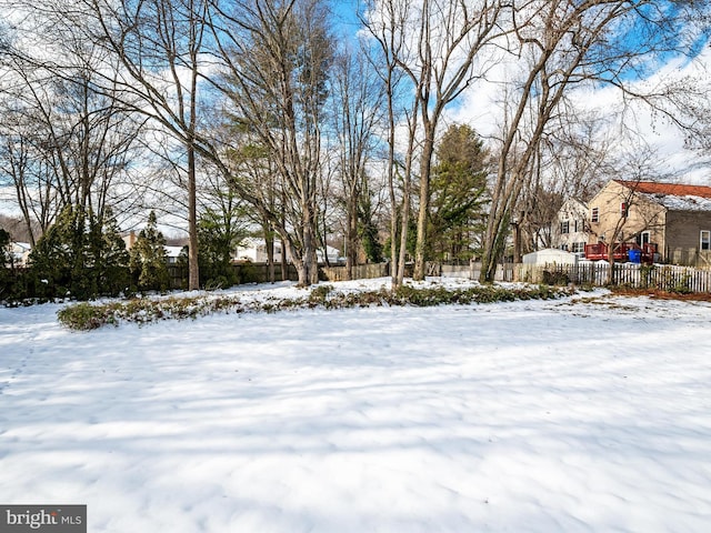 view of yard layered in snow