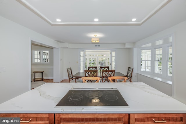 4901 Stillwell Ave, Alexandria, VA 22309 - kitchen featuring recessed lighting, brown cabinetry, a healthy amount of sunlight, and black electric stovetop