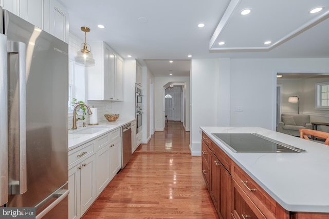 4901 Stillwell Ave, Alexandria, VA 22309 - kitchen with recessed lighting, white cabinetry, stainless steel appliances, and a sink