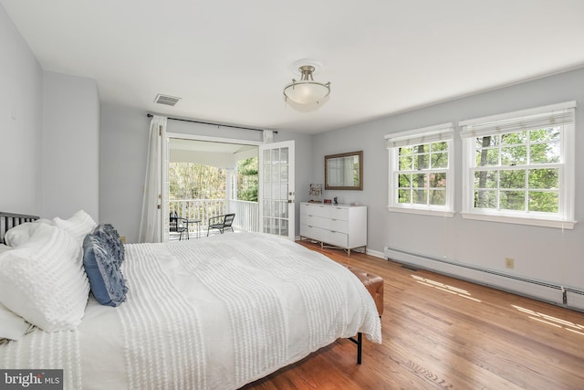 4901 Stillwell Ave, Alexandria, VA 22309 - bedroom featuring visible vents, baseboard heating, multiple windows, and access to exterior