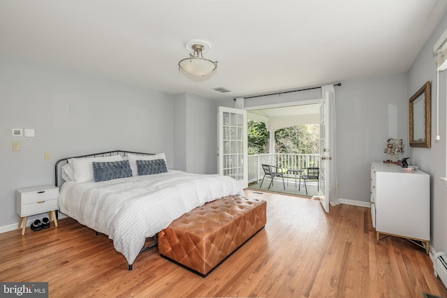 4901 Stillwell Ave, Alexandria, VA 22309 - bedroom with a baseboard heating unit, light wood-type flooring, baseboards, access to outside, and visible vents