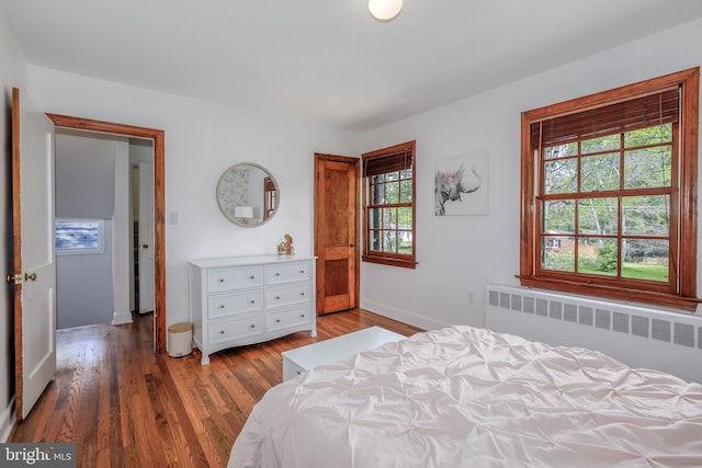 4901 Stillwell Ave, Alexandria, VA 22309 - bedroom featuring radiator, baseboards, and wood finished floors