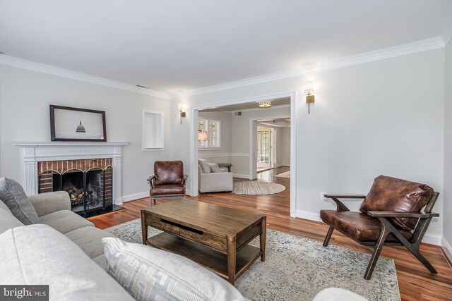 4901 Stillwell Ave, Alexandria, VA 22309 - living room with wood finished floors, a fireplace, and ornamental molding