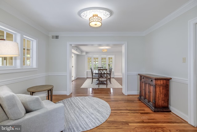 4901 Stillwell Ave, Alexandria, VA 22309 - living area with crown molding, wood finished floors, and visible vents