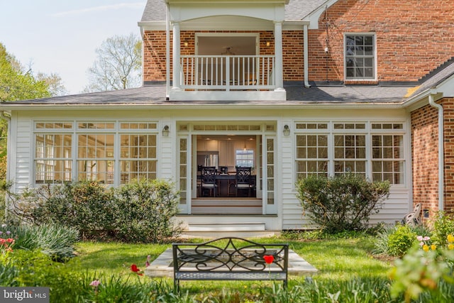 4901 Stillwell Ave, Alexandria, VA 22309 - back of house featuring a shingled roof, a balcony, and brick siding