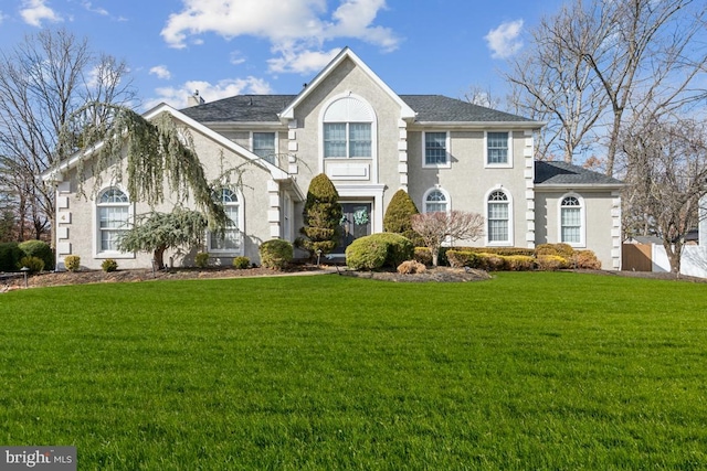 colonial-style house with a front lawn