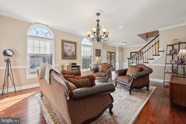 living room with ornamental molding, dark hardwood / wood-style floors, and a chandelier