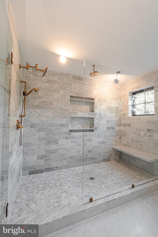 bathroom with a tile shower