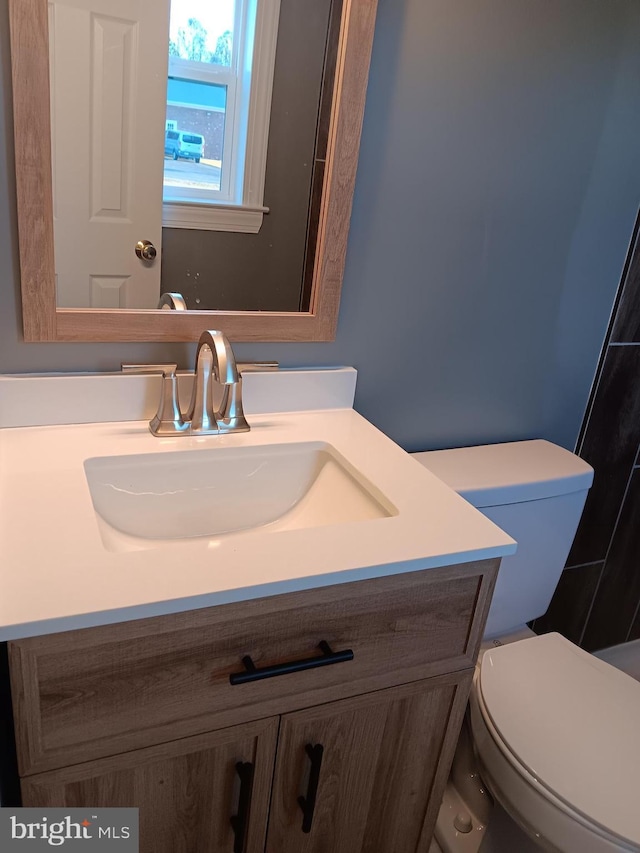 bathroom with vanity and toilet