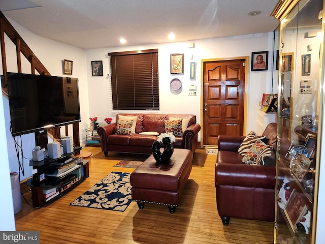 living room with light hardwood / wood-style flooring