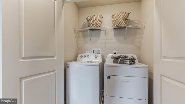 laundry area with washing machine and dryer