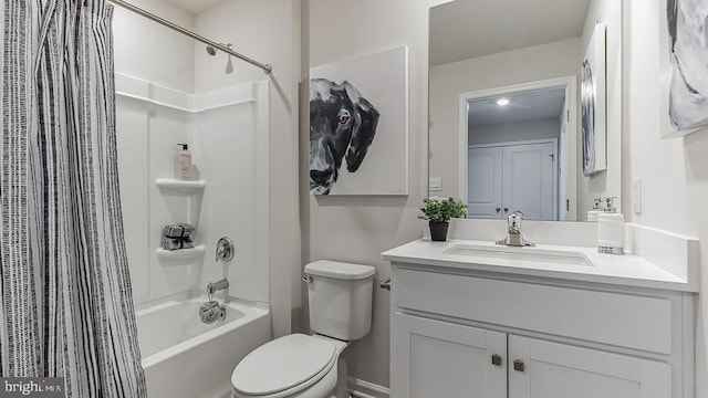 full bathroom featuring shower / bath combo with shower curtain, vanity, and toilet