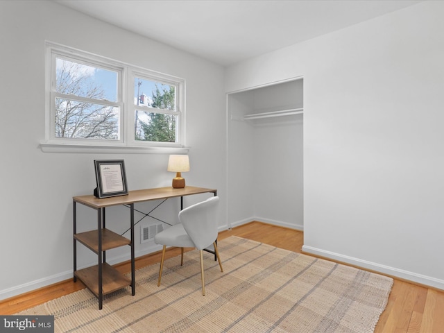 office space with light hardwood / wood-style floors