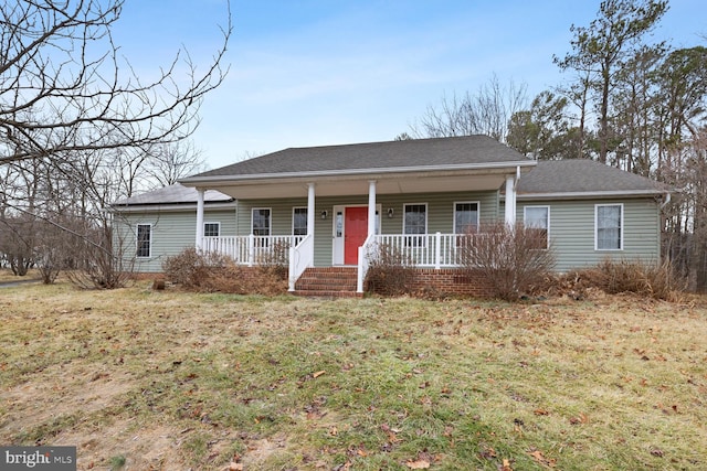 single story home with a front yard and covered porch