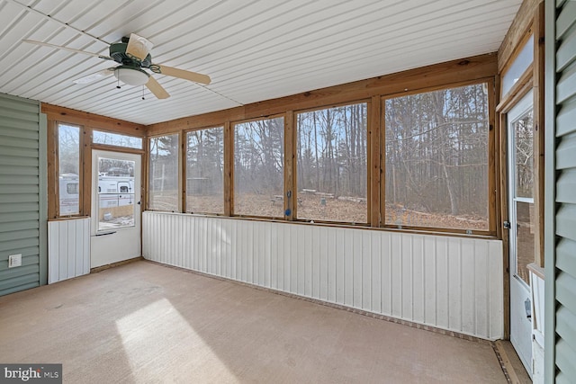 unfurnished sunroom with ceiling fan and a healthy amount of sunlight