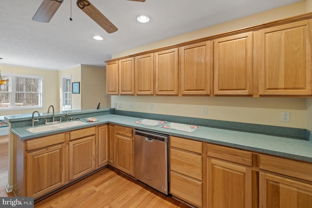 kitchen with sink, stainless steel dishwasher, kitchen peninsula, ceiling fan, and light hardwood / wood-style floors