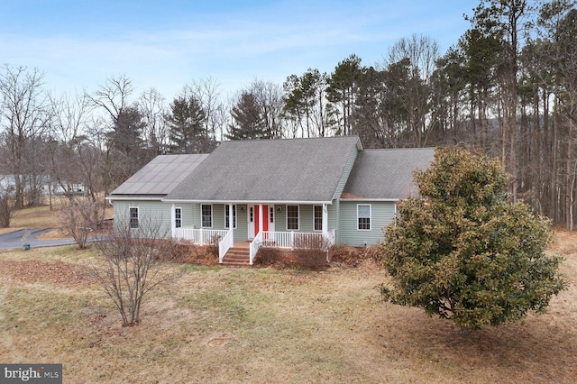 view of front of property with a front lawn and covered porch