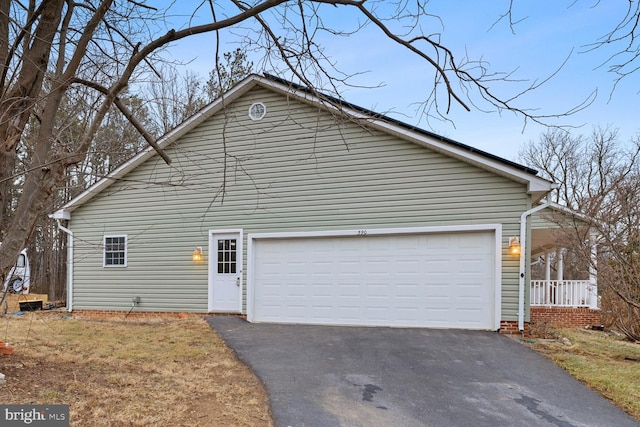 view of side of home with a garage