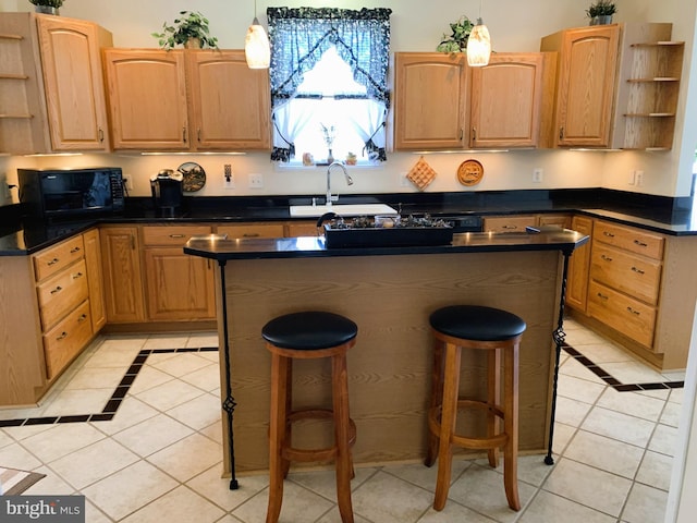 kitchen featuring light tile patterned flooring, a kitchen breakfast bar, and hanging light fixtures