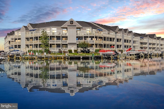 outdoor building at dusk featuring a water view