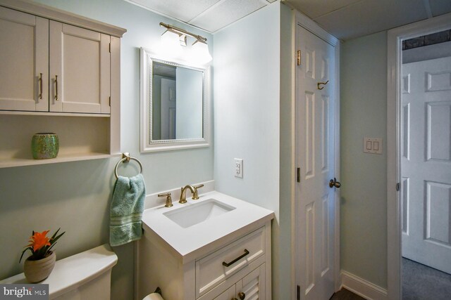 bathroom with vanity and toilet