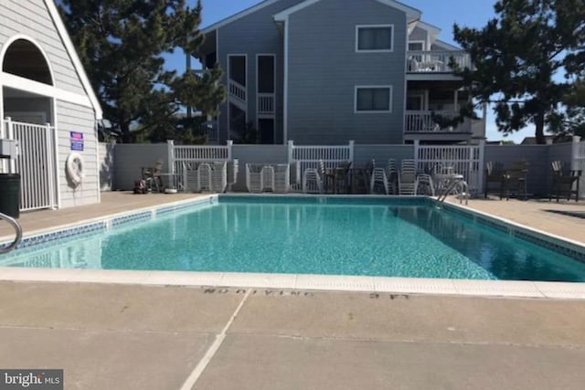 view of swimming pool featuring a patio area