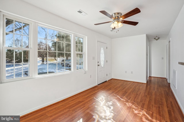 foyer entrance featuring ceiling fan and dark hardwood / wood-style floors