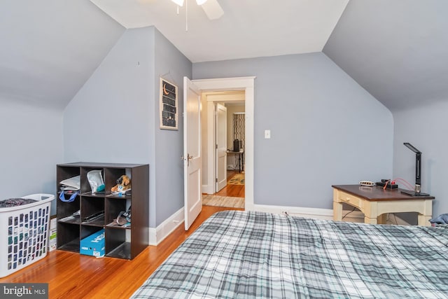 bedroom with light wood-type flooring, ceiling fan, and lofted ceiling