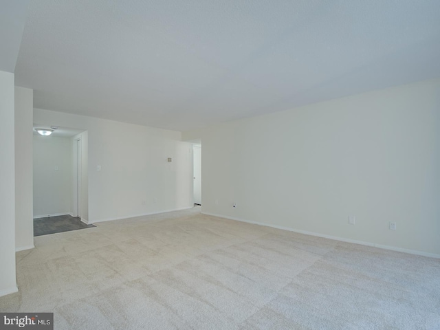 spare room with light colored carpet