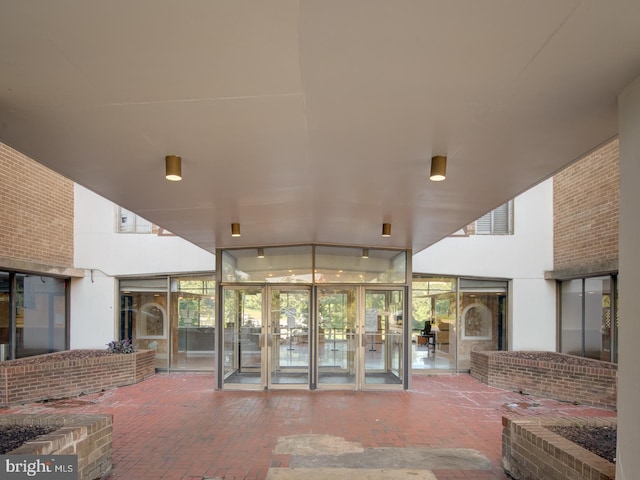 entrance to property featuring a patio area