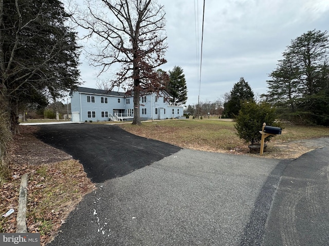 raised ranch with a front lawn