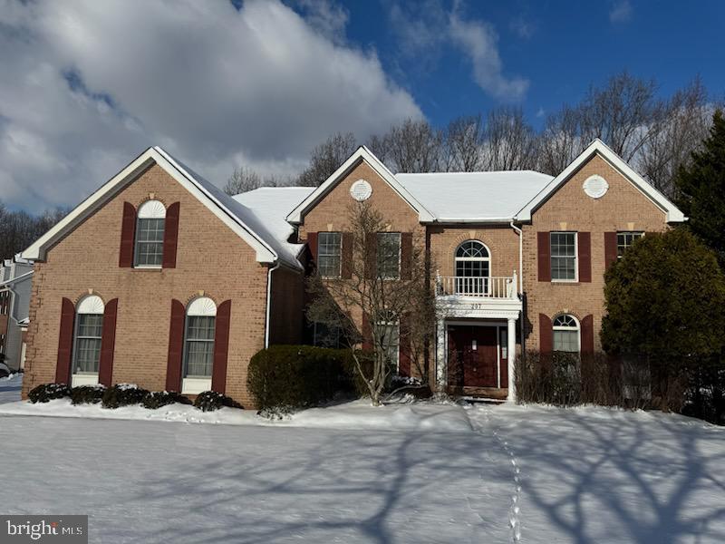 view of front of home with a balcony