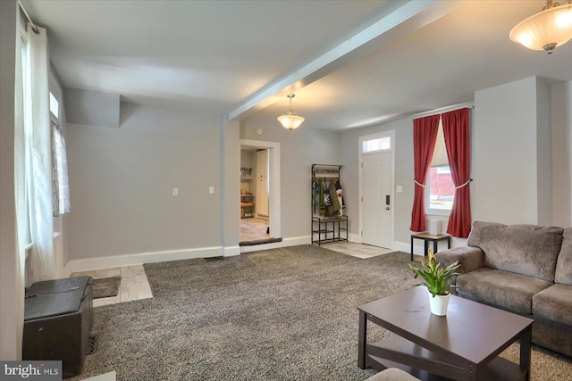 carpeted living room featuring baseboards