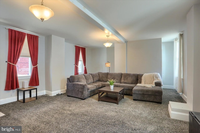 carpeted living area featuring beamed ceiling and baseboards