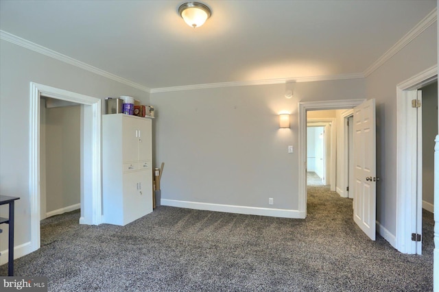 unfurnished bedroom with carpet floors, baseboards, and ornamental molding