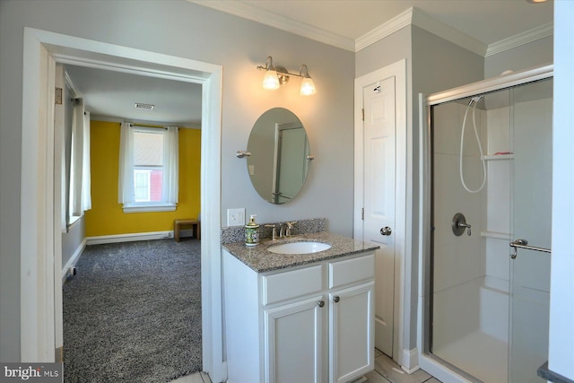 bathroom with visible vents, a shower stall, and ornamental molding