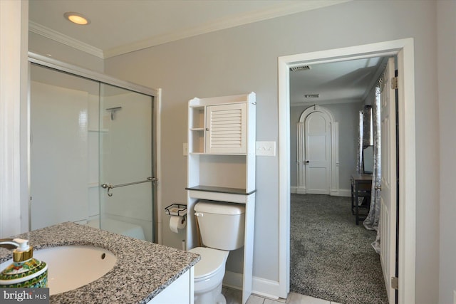 full bathroom featuring an enclosed shower, toilet, vanity, and ornamental molding